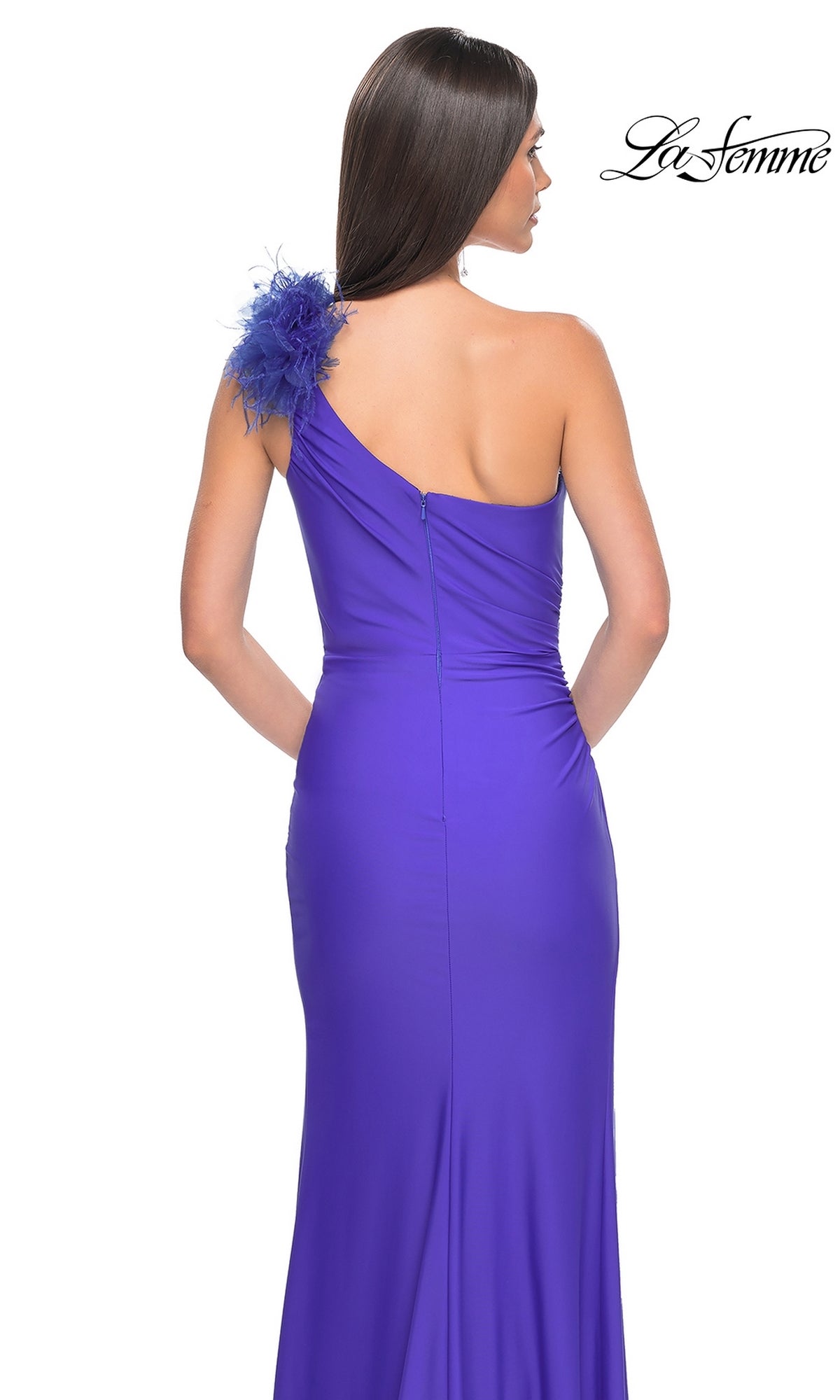 A woman models the La Femme Feathered One-Shoulder Prom Dress 32076, featuring a fitted silhouette and feathered shoulder accent, shown from the back against a white background—perfect for formal occasions.